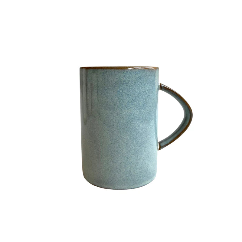 A blue mug is shown which has a brown rim and brown line on the handle. 
