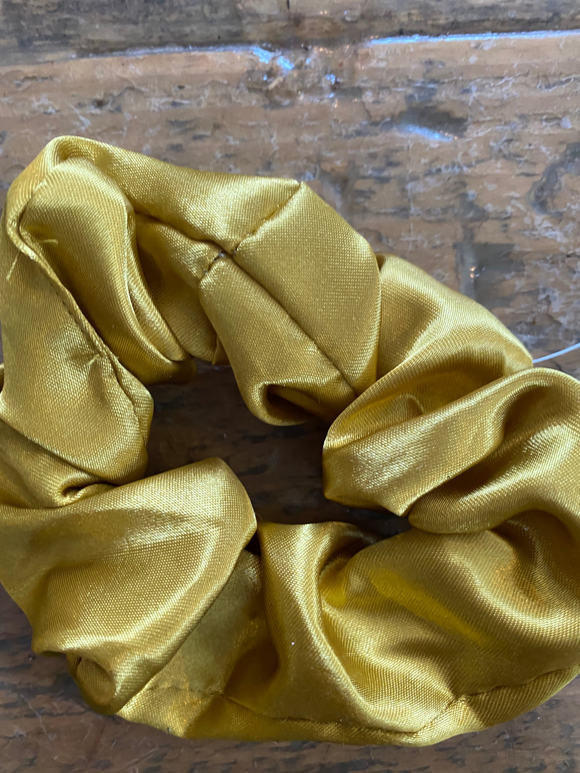 Gold satin scrunchy hair tie