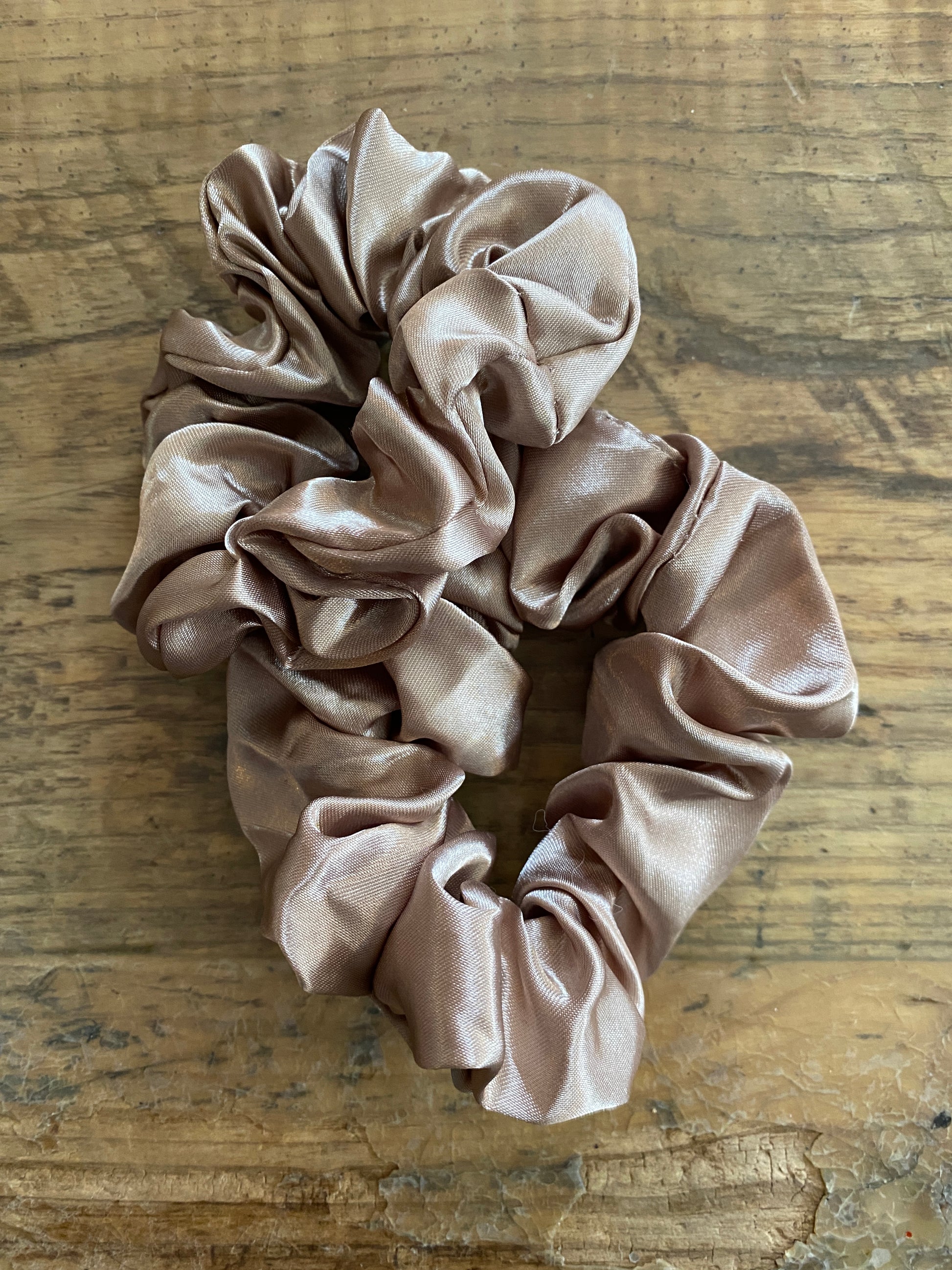 Light taupe satin scrunchy hair tie.