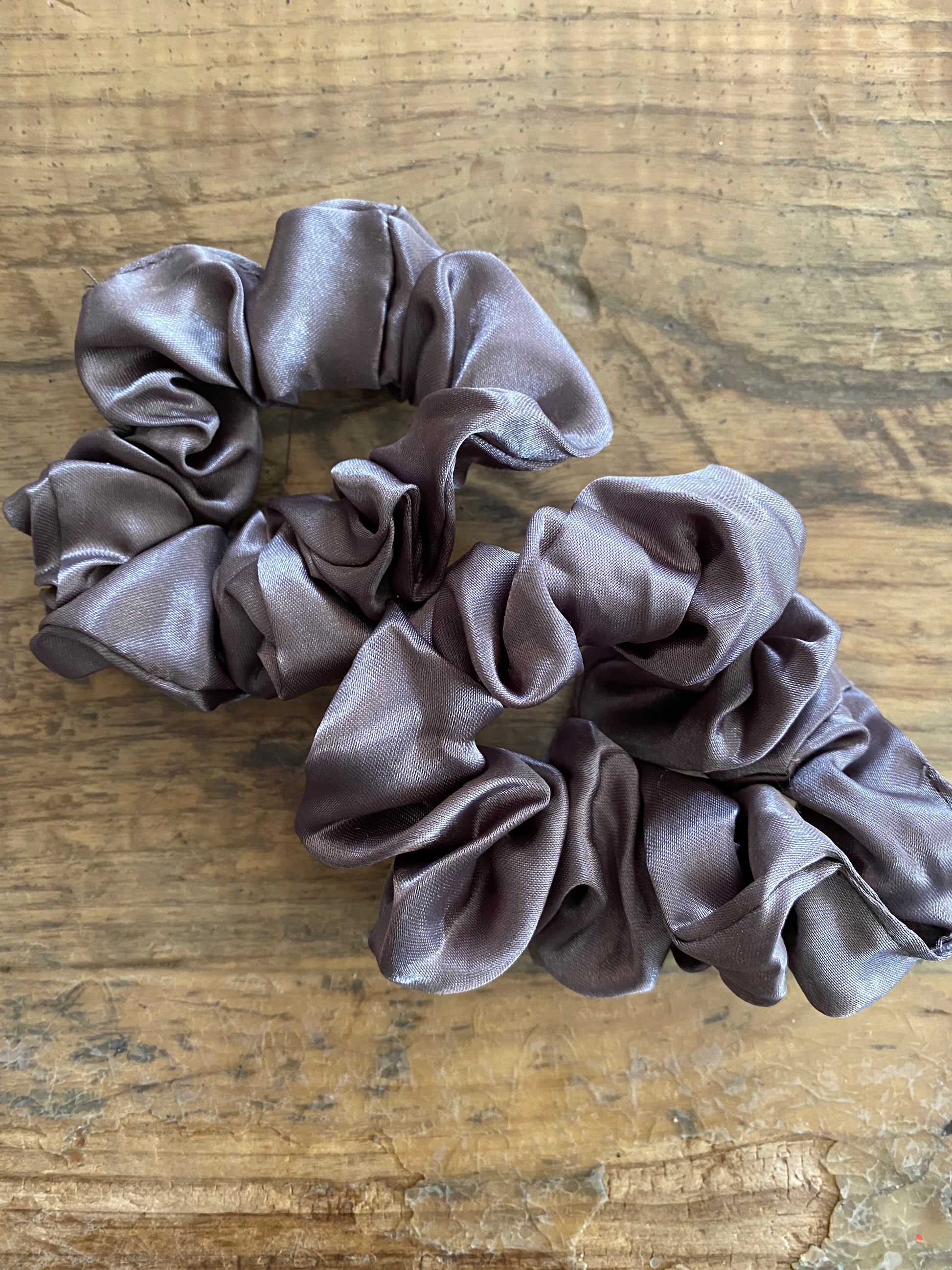 Mid tone gray satin scrunchy hair tie. 