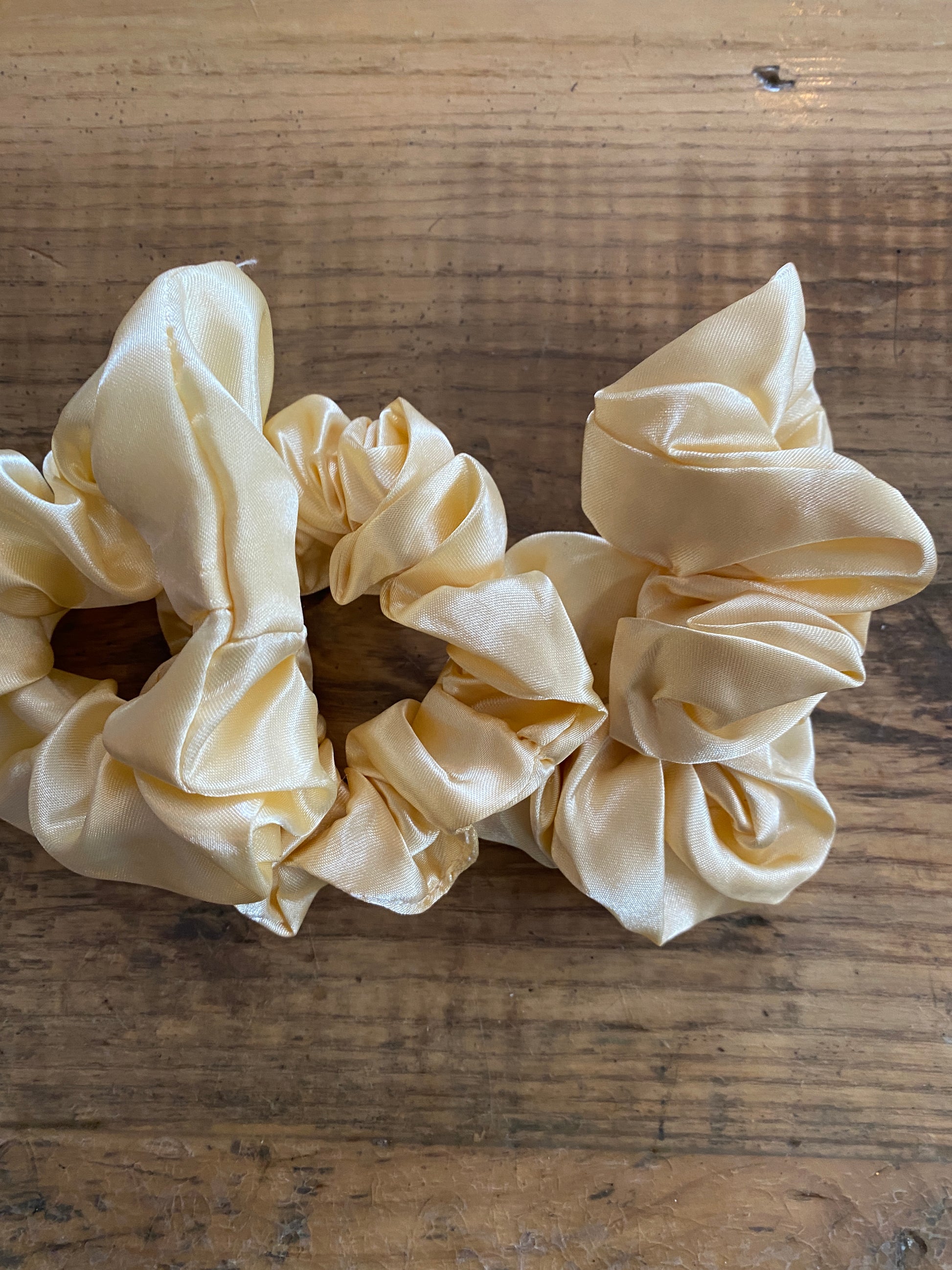 Pale Yellow satin scrunchy hair tie.