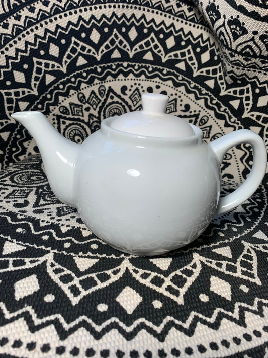 Small white teapot