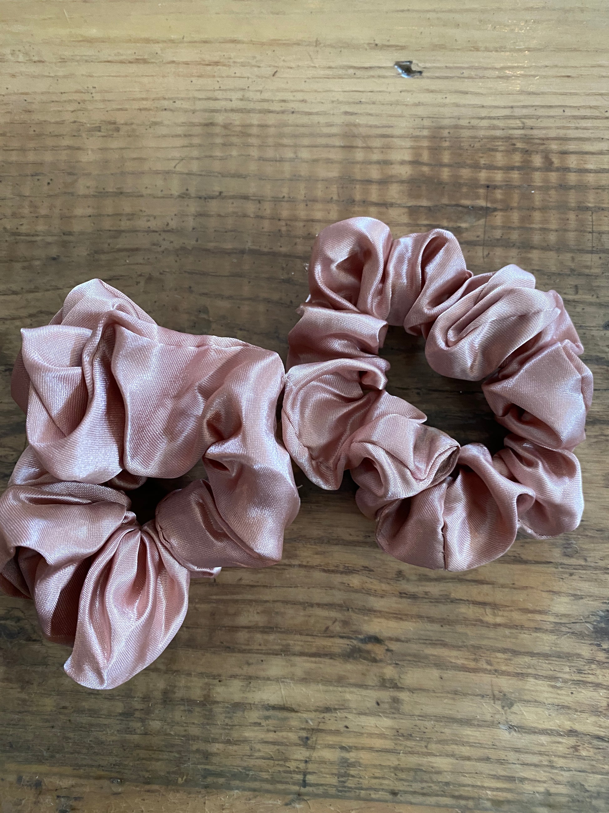 Blush satin scrunchy hair tie.