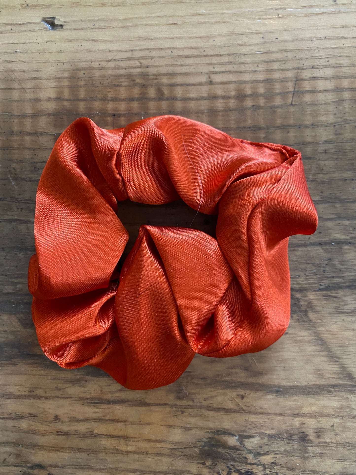 Burnt orange satin scrunchy hair tie